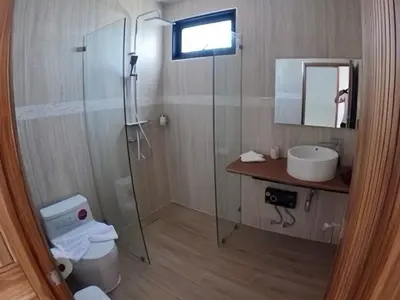 a bathroom with a shower and a sink and a toilet at Rawai 2 Bedrooms Private Pool Villa in Ban Saiyuan (1)