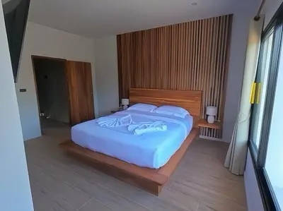a bedroom with a large bed in a room at Rawai 2 Bedrooms Private Pool Villa in Ban Saiyuan (1)