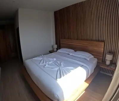 a bedroom with a large bed with white sheets and pillows at Rawai 2 Bedrooms Private Pool Villa in Ban Saiyuan (1)