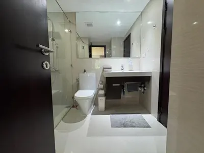 a bathroom with a toilet and a sink and a shower at Apartment Title II, Rawai Phuket in Rawai Beach