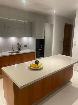 a kitchen with a bowl of fruit on a counter at Anchan Flora Luxury 2BR Pool Villa in Thalang