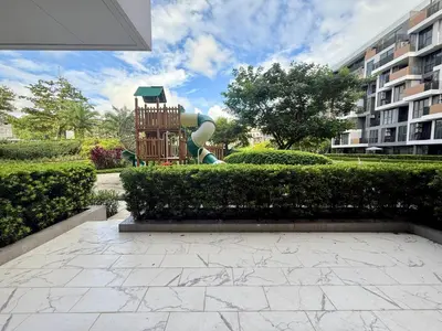 a playground with a slide in a park at Laguna cozy 2 bedroom apartment 5min to the beach in Laguna Phuket