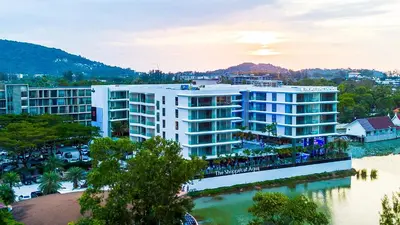 an aerial view of a building next to a river at Lakefront suite The Aqua at Boat avenue in Bang Tao Beach