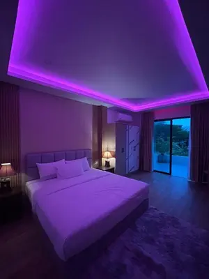 a bedroom with a large bed with a purple ceiling at Luxury 4BR Private Pool Villa Sunset Rooftop in Phuket Town