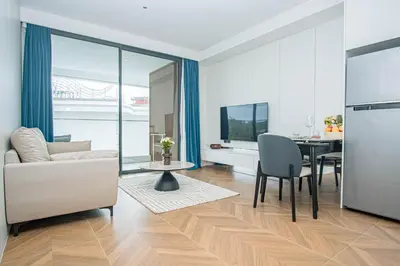 a living room with a couch and a table at Coastal 1 bd apartment - Moments from the sea in Layan Beach