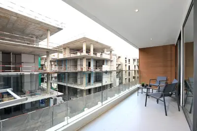 a view of a building under construction from a balcony at 2BR Layan Beach Apartment Capital Pro Kora D244 in Layan Beach