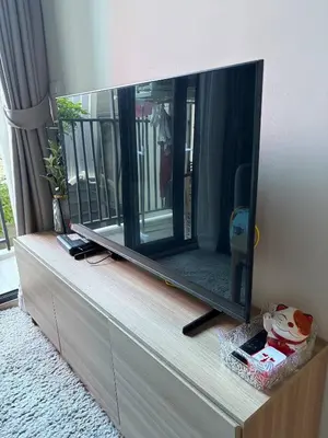 a large mirror on a dresser in a living room at Phuket, Best location, full furnished 1bedroom in Ban Rangeng