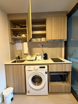 a kitchen with a washing machine and a sink at Phuket, Best location, full furnished 1bedroom in Ban Rangeng