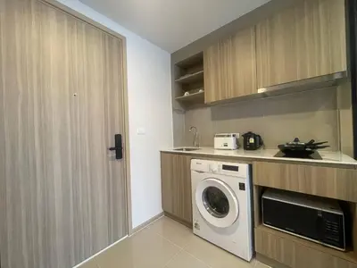a kitchen with a washer and dryer in a room at Phuket, Best location, full furnished 1bedroom in Ban Rangeng