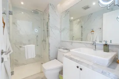 a bathroom with a sink and a shower and a toilet at Seavale patong phuket in Patong Beach