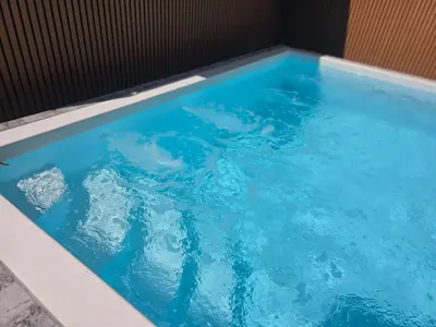 a swimming pool with blue water in it at Kathu V pool villa soi Srikor in Ban Kathu