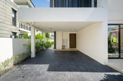 an internal courtyard of a house with white walls at Lux Laguna Park 5 bedroom rooftop pool in Laguna Phuket