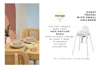 a dining room table with a chair and a table and a sign that says trust at Mango Moon Phuket Art Haus 1 BR Near Central Phuket in Ban Nong Chaeng