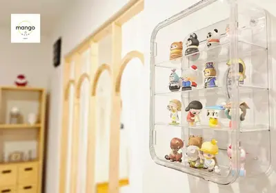 a glass display case filled with lots of toy figurines at Mango Moon Phuket Art Haus 1 BR Near Central Phuket in Ban Nong Chaeng