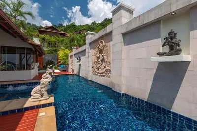 a swimming pool with a fountain in a house at Stunning Sea & Sunset Views Villa over Patong Bay in Patong Beach