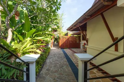 a walkway leading up to a house with plants at Stunning Sea & Sunset Views Villa over Patong Bay in Patong Beach
