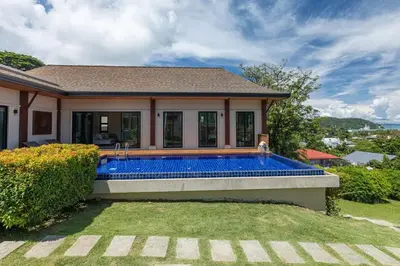 a swimming pool in the backyard of a house at Ocean-View 3-Bed Villa Retreat - Ao Yon Hillside in Ban Ao Makham