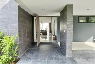 a hallway of a house with gray tiles at 6-Bedroom Villa in Laguna Park 2 Phuket in Ban Phru Champa