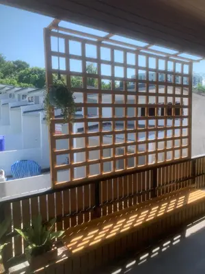 a window on a balcony with a view at Nai Yang Guest House in Nai Yang Beach