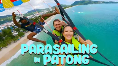 a poster for paragliding in paragalore at XX Bao Patong Beach - เบา ป่าตอง ภูเก็ต in Patong Beach
