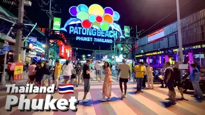 a crowd of people walking down a street at night at XX Bao Patong Beach - เบา ป่าตอง ภูเก็ต in Patong Beach