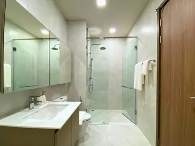 a bathroom with a sink and a glass shower at New 2 Br Apartment Cherng talay in Laguna Phuket