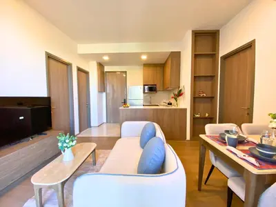 a living room with a couch and a table at New 2 Br Apartment Cherng talay in Laguna Phuket