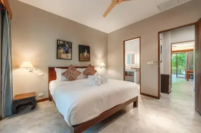 a bedroom with a large bed in a room at Peaceful Retreat at Villa Langkah Luan, Mai Khao in Mai Khao Beach