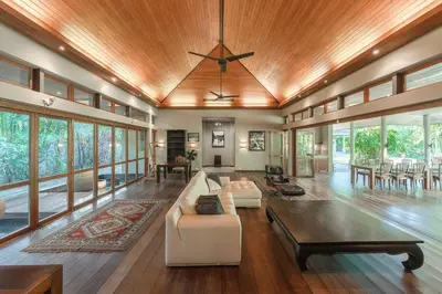 a living room with a couch and a table at Peaceful Retreat at Villa Langkah Luan, Mai Khao in Mai Khao Beach