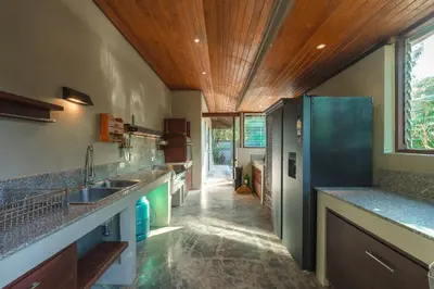 a kitchen with a sink and a wooden ceiling at Peaceful Retreat at Villa Langkah Luan, Mai Khao in Mai Khao Beach