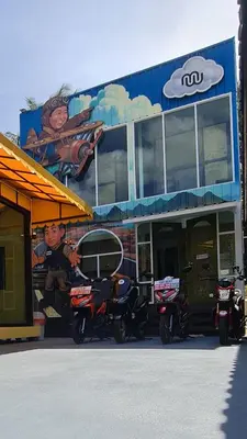 a group of motorcycles parked in front of a building at Sleep On The Clouds in Ban Kata