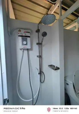 a shower in a bathroom with a toilet at Sleep On The Clouds in Ban Kata