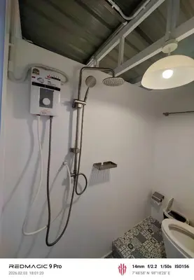 a bathroom with a shower and a toilet at Sleep On The Clouds in Ban Kata