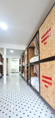 a hallway with bunk beds in a room at Sleep On The Clouds in Ban Kata
