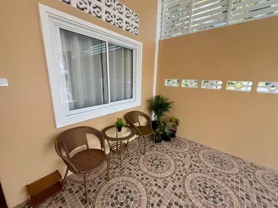 a room with chairs and a table and a window at Vida House Krabi, Ao Nang Beach in Ban Khlong Haeng