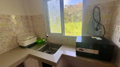 a small kitchen with a sink and a window at Vida House Krabi, Ao Nang Beach in Ban Khlong Haeng