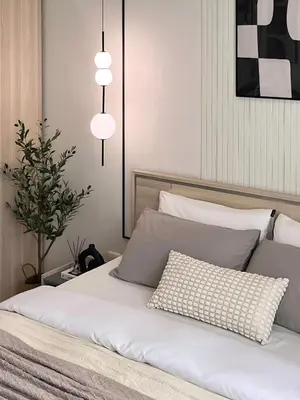 a bedroom with a white bed with two pillows at CHIC CONDO - Cozy studio with mountain and sea views in Karon Beach