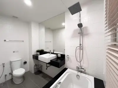 a bathroom with a tub and a toilet and a sink at CHIC CONDO - Cozy studio with mountain and sea views in Karon Beach