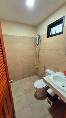 a bathroom with a toilet and a sink at Jasmine Seaview 'C' Friendly Guest House in Ban Saiyuan (1)