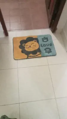a rug with a monkey on it on a bathroom floor at Jasmine's Bungalow 3 bedroom 2 bathrooms Baby Cots in Ban Saiyuan (1)