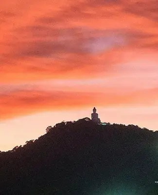 a painting of a lighthouse on top of a hill at Jasmine Ocean View Penthouse in Ban Saiyuan (1)