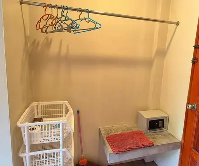 a room with a basketball hoop and a microwave at Jasmine Seaview 'A1' Friendly Guesthouse in Ban Saiyuan (1)