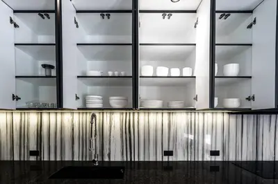 a kitchen with white bowls and plates on shelves at Alex Villa by G Estate Phuket in Ban Saiyuan (1)