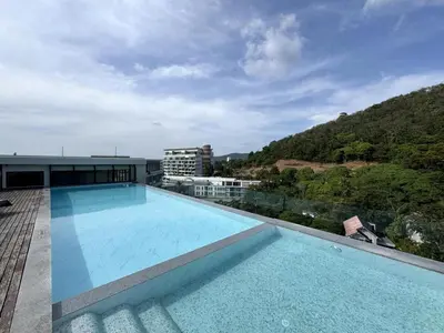 a large swimming pool on top of a building at A Taste of Utopia -Modern Phuket Retreat with Jacuzzi in Karon Beach