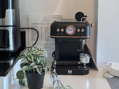 a coffee maker sitting on a counter with a plant at A Taste of Utopia -Modern Phuket Retreat with Jacuzzi in Karon Beach