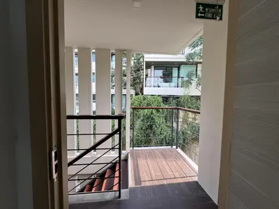a view of a balcony from a house at A Taste of Utopia -Modern Phuket Retreat with Jacuzzi in Karon Beach