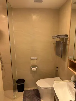a bathroom with a toilet and a sink at Laguna SkyPark in Laguna Phuket