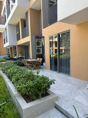 a courtyard of a apartment building with a patio at Laguna SkyPark in Laguna Phuket