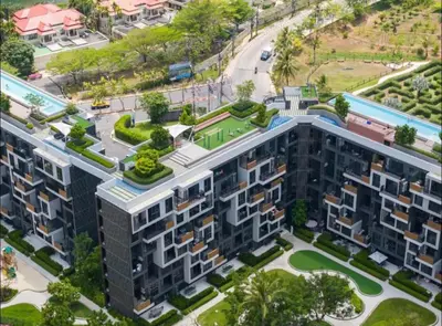 an overhead view of an apartment building with trees at Laguna SkyPark in Laguna Phuket