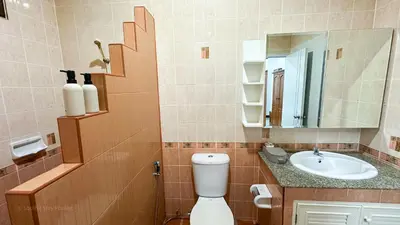 a bathroom with a toilet and a sink at Soulful Stay Phuket l Phanason Park Ville 1 Near Kathu Waterfall in Ban Kathu